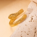 Close-up of golden snake ring with scales texture and flexible wrap-around design - Gold Style 8