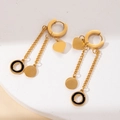 Detail of gold titanium heart tassel earrings featuring sleek black rings and chain drops - Gold Hoop Heart