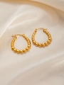 Close-up of gold beaded teardrop earrings on elegant champagne satin fabric background - U-Shaped E0250 Style