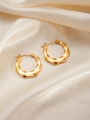 Detailed view of French vintage twisted gold hoop earrings on champagne silk background - U-Shaped E0252 Style