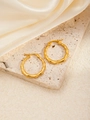 Detailed view of gold bamboo texture hoop earrings on beige stone and satin fabric - Bamboo Shaped Hoop (BJGE0253)