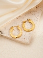 Close-up of golden ribbed hoop earrings with X design on white stone and satin - Cross X-shaped Ribbed (BJGE0257)