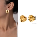 Boucles d'oreilles nœud torsadé en or poli en acier titane pour un look rétro chic - Style Torsadé en Spirale