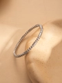 Macro detail of silver-tone textured beads and long tube links on a sleek steel bracelet - Silver Spiral Bead Style