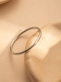 Polished silver stainless steel minimalist bracelet on a cream aesthetic tray - Silver High Polish Plain Style