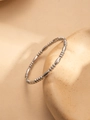 Detail view of a minimalist silver beaded steel bracelet draped on a ceramic prop - Silver Long Tube Bead Combo