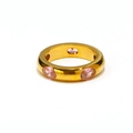 Macro shot of 18k gold plated ring with pink cubic zirconia stones on polished metal - US 6 / Gold Pink Zirconia