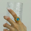 Detail of snake scale texture and turquoise stone on gold titanium steel ring - Gold Turquoise
