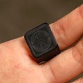 Macro shot of men's matte black stainless steel signet ring with engraved compass star - US 7 / Black