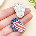 Hand holding American flag patterned lip-shaped alloy pendant for DIY keychain making - White K Blue Enamel Independence Day Tongue
