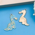 Sky blue dinosaur enamel alloy pendants with pink floral patterns and golden metal backs - Lake Blue Enamel Cartoon Dinosaur Style (18105)