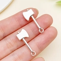 Pair of antique silver axe pendants for DIY jewelry making shown on fingers for scale - Antique Silver Axe Style (11183)