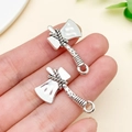 Antique silver axe charm pendant in zinc alloy held by hand for DIY jewelry making - Antique Silver Axe Style (18406)