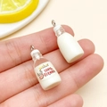 DIY jewelry charm set with organic milk bottle pendants made of resin in white and cream - Transparent Organic Milk Bottle
