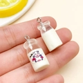 Miniature resin milk bottle pendant with cartoon cow print and metal keychain hook - Transparent Milk Bottle