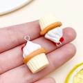 Miniature resin cupcake charm in white and orange for DIY jewelry making - Yellow Resin Food Heart Cream Cupcake (24085)