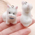 Miniature white flocked dog charms for DIY jewelry and keychains showing front and back details - Sitting White Puppy with Blue Scarf (24805) / 33x30x19mm
