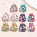 Detailed view of ten colorful enamel cat charms with flower patterns for DIY jewelry - Mixed