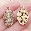 Oval gold plated football charm with rhinestones and honeycomb texture for DIY jewelry - Champagne Enamel Rhinestone Rugby (24943) / 26.5x14x3mm