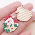 DIY Santa Claus enamel charm with festive holly accents and textured golden metal back - Red Enamel Christmas Newspaper Santa Style (25274)