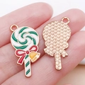 Cartoon lollipop alloy charm with green spiral oil drip design and festive red bow detail - Green Enamel Christmas Bow Bell Lollipop Style (25280)