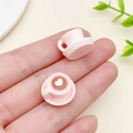 Miniature pink resin coffee cup charm with heart latte art detail on a fingertip - Pink 3D Heart Latte Art Style (23955)