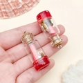 Mini resin wishing bottle charm with pink paper roll and cork stopper for DIY jewelry - Transparent Red