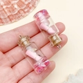 Mini ocean themed resin wishing bottle pendant with pink scrolls and tiny shells - Transparent Pink