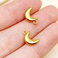 Golden crescent moon stainless steel charms for DIY jewelry making shown in hand - Moon Style (T3101)