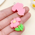 Pink resin cherry blossom pendant with green leaves and yellow pistil for DIY jewelry - Rose Red Resin Five Petal Flower (24348) / 29x23x7mm