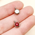 Stainless steel 6mm round pendant with vibrant red crystal and vertical hole for DIY jewelry - January Dark Red Steel Color Star Stone (T2907)