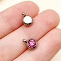 Pink gemstone pendant in round stainless steel setting showing front and back views - February Deep Rose Red Steel Color Stone (T2908)