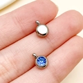 Stainless steel 6mm round pendant with deep blue gemstone inlay and polished silver finish - March Light Blue Steel Color Star Stone (T2909)