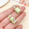 Miniature pale green resin milk bottle charms for DIY jewelry making projects - Transparent Green Milk Bottle