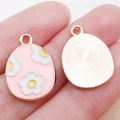 Pink enamel Easter egg charm with white flowers and rose gold textured metal back - Pink Enamel Flower Egg
