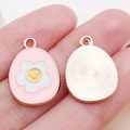Pink enamel flower charm with yellow smiley face in rose gold alloy for DIY jewelry - Pink Enamel Plumeria Egg