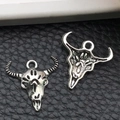 Macro view of vintage silver bull skull pendants showing front and back metal details - Ethnic Style Bull Head (10865) / 20x20mm
