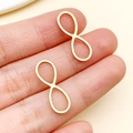 Pair of gold stainless steel infinity charms for DIY jewelry making and handmade crafts - Gold