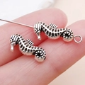 Antique silver seahorse charms for jewelry making featuring detailed metal textures - Ocean Seahorse Spacer Bead (15987)