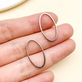 Colgantes ovalados de acero inoxidable pulido para joyería DIY en acabado plata brillante - Estilo Ovalado Mediano (T1879)