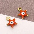Colgantes de estrella en esmalte naranja con ojo turco dorado para joyería DIY - Ojo Turco Estrella Naranja / 9x10mm