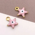 Colgantes de estrella en esmalte rosa con ojo turco y bordes dorados para bisutería - Ojo Turco Estrella Rosa / 9x10mm