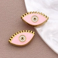 Colgante ojo turco rosa con acabado dorado y detalles de esmalte para crear joyas DIY - Cuenta Ojo Rosa / 9x15x4mm