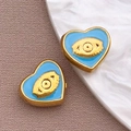 Colgantes de corazón dorados con esmalte azul claro y detalle central de ojo turco - Cuenta Corazón Azul / 9x10x4.5mm