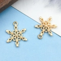 Golden snowflake charm pendant for DIY jewelry making with intricate cutout design - Christmas Snow / 15x19mm (18324)