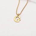 Macro shot of polished gold-plated letter G pendant on a stainless steel box chain - Letter G (BJGN0271) / Gold