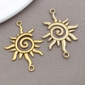 Colgante de sol de acero inoxidable oro mate con espiral central y dos anillas de enganche - Colgante de Sol Dorado con Doble Agujero / 15x35x2mm