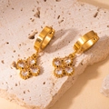 Detail of 18K gold flower earrings with pear-shaped crystals on natural stone background - Pear Shape Four-petal Flower Style (BJGE0745) / Transparent White #5