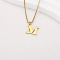 Detail of a gold letter M pendant on a box chain necklace with a metallic finish - Letter M (BJGN0271) / Gold