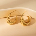 Macro detail of gold-plated titanium steel earrings with multi-layer spiral texture - Twisted Lines (BJGE0854) / Gold